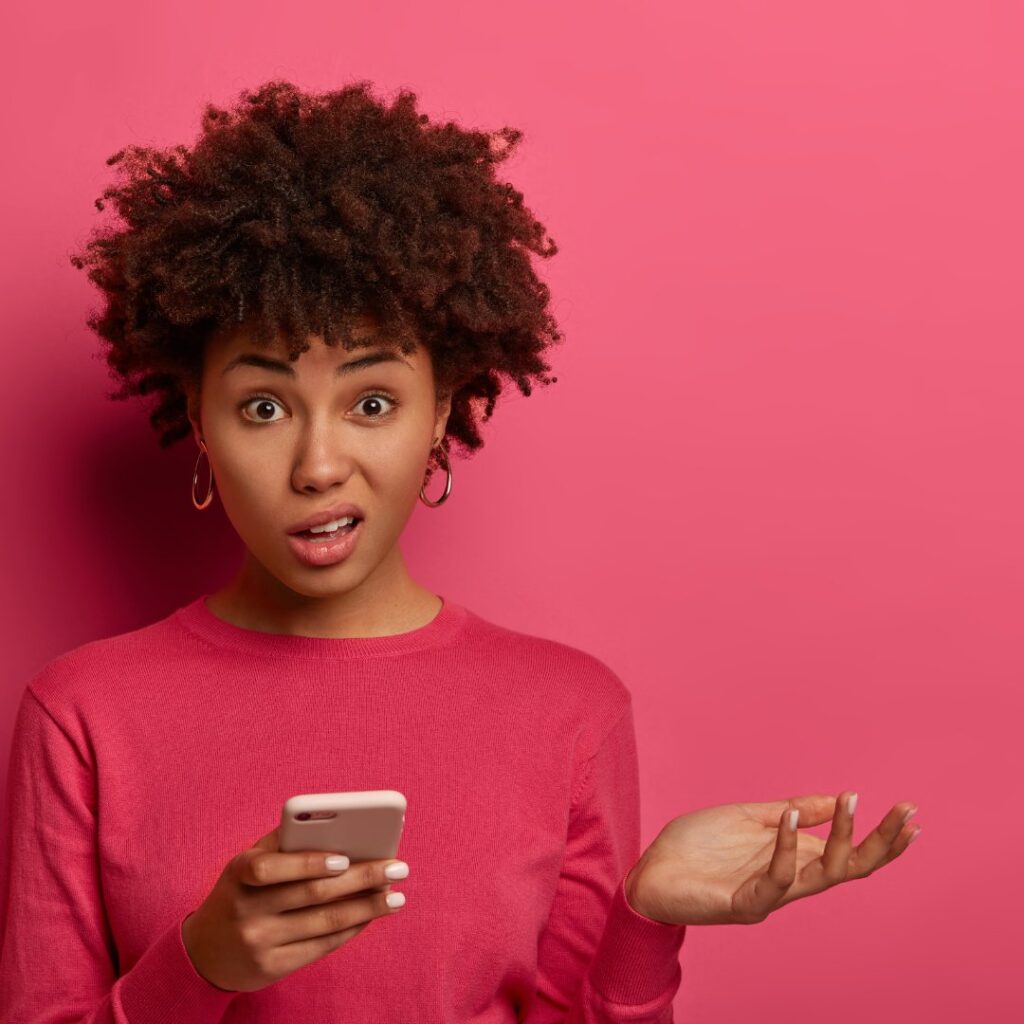 lady in pink sleeves with confused and questioning face